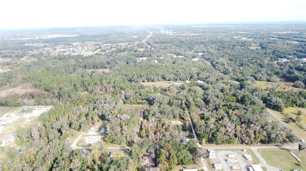 0 Southeast 65th Terrace Summerfield, FL 34491 - Photo 1 of 5 an aerial view of residential houses with outdoor space