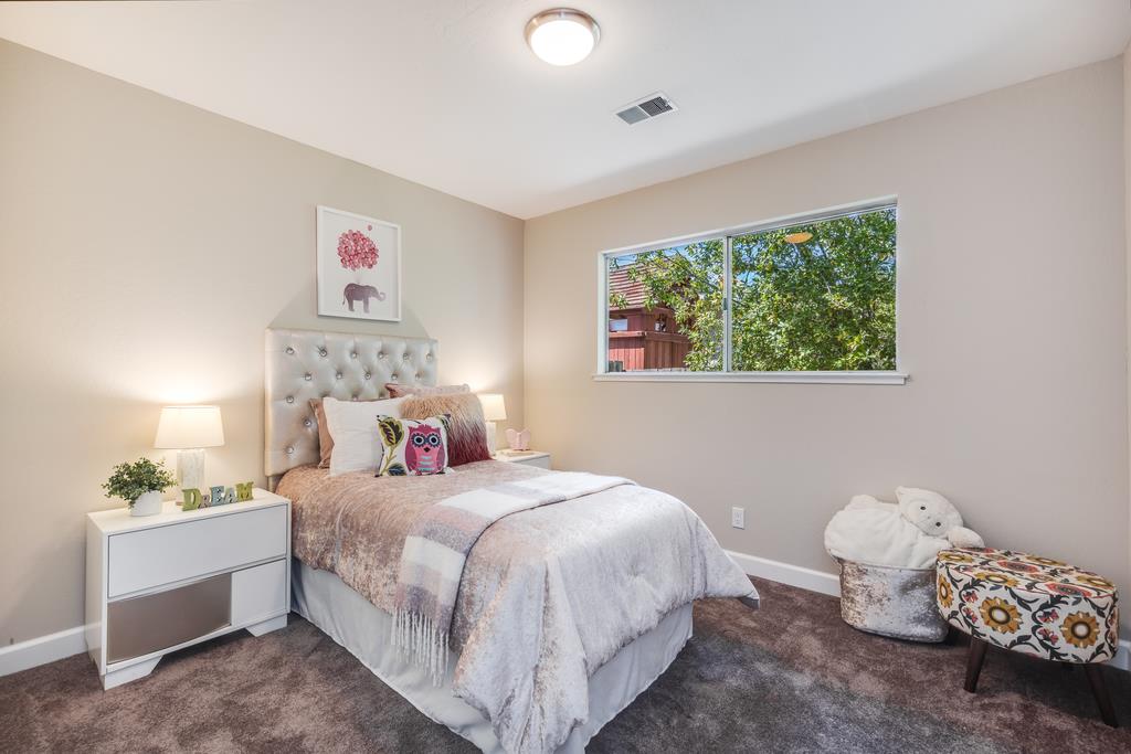 16239 Jacaranda Way Los Gatos, CA 95032 - Photo 12 of 20 a bedroom with a bed and a window