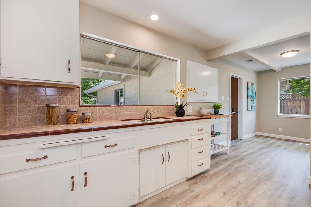 16239 Jacaranda Way Los Gatos, CA 95032 - Photo 8 of 20 a spacious bathroom with double sink and a large mirror