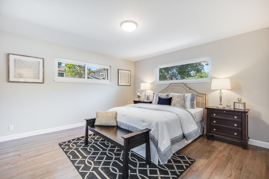 16239 Jacaranda Way Los Gatos, CA 95032 - Photo 9 of 20 a bedroom with a bed and a night stand