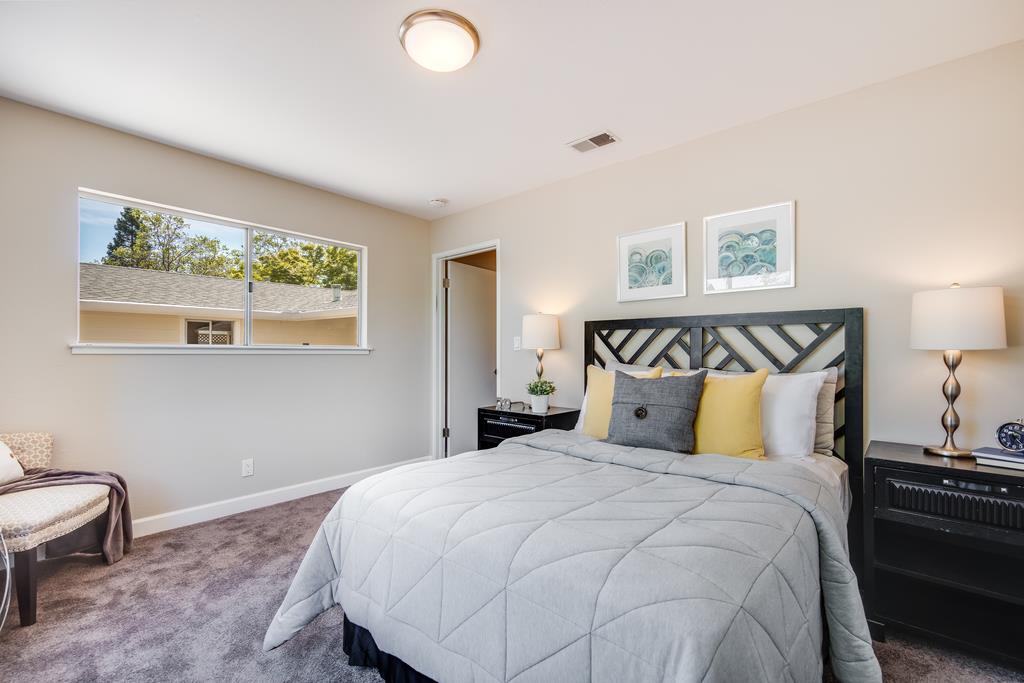 16239 Jacaranda Way Los Gatos, CA 95032 - Photo 10 of 20 a bedroom with a bed and a window