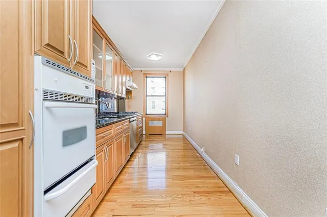 a view of a kitchen from the hallway