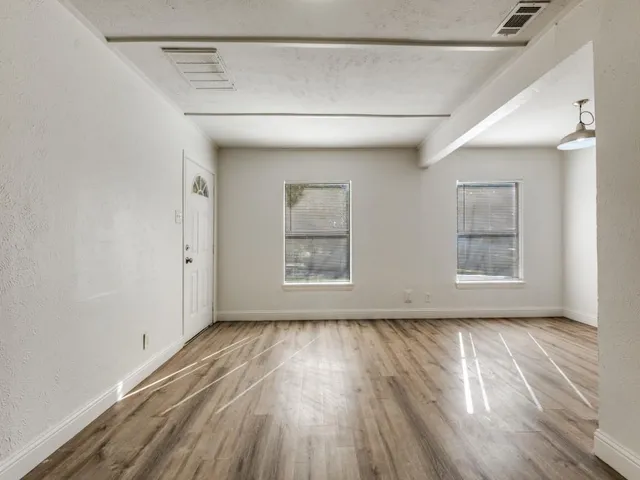 a view of a kitchen from the hallway