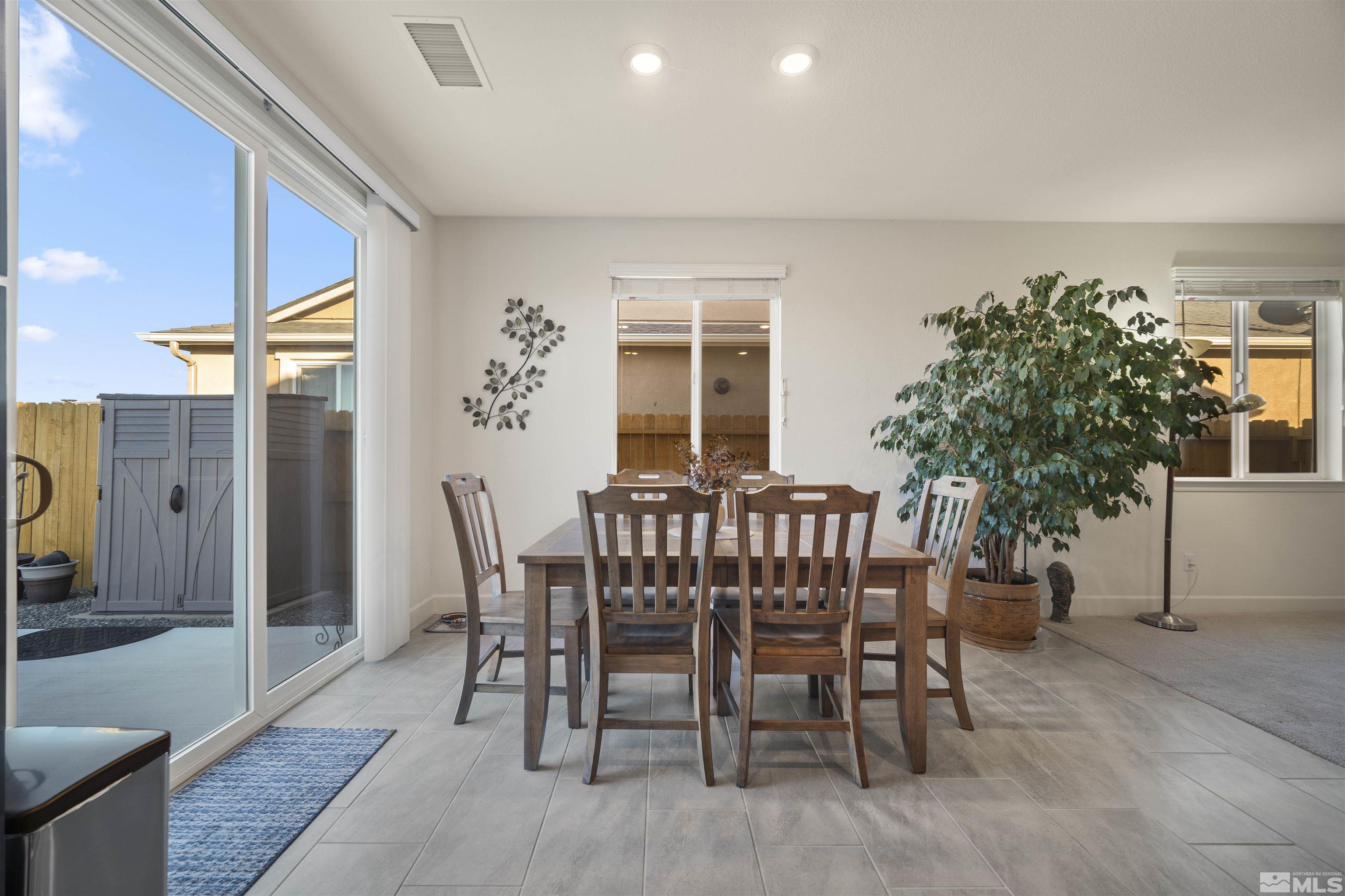 6713 Eagle Peak Drive Carson City, NV 89701 - Photo 15 of 40 a view of a dining room with furniture and window