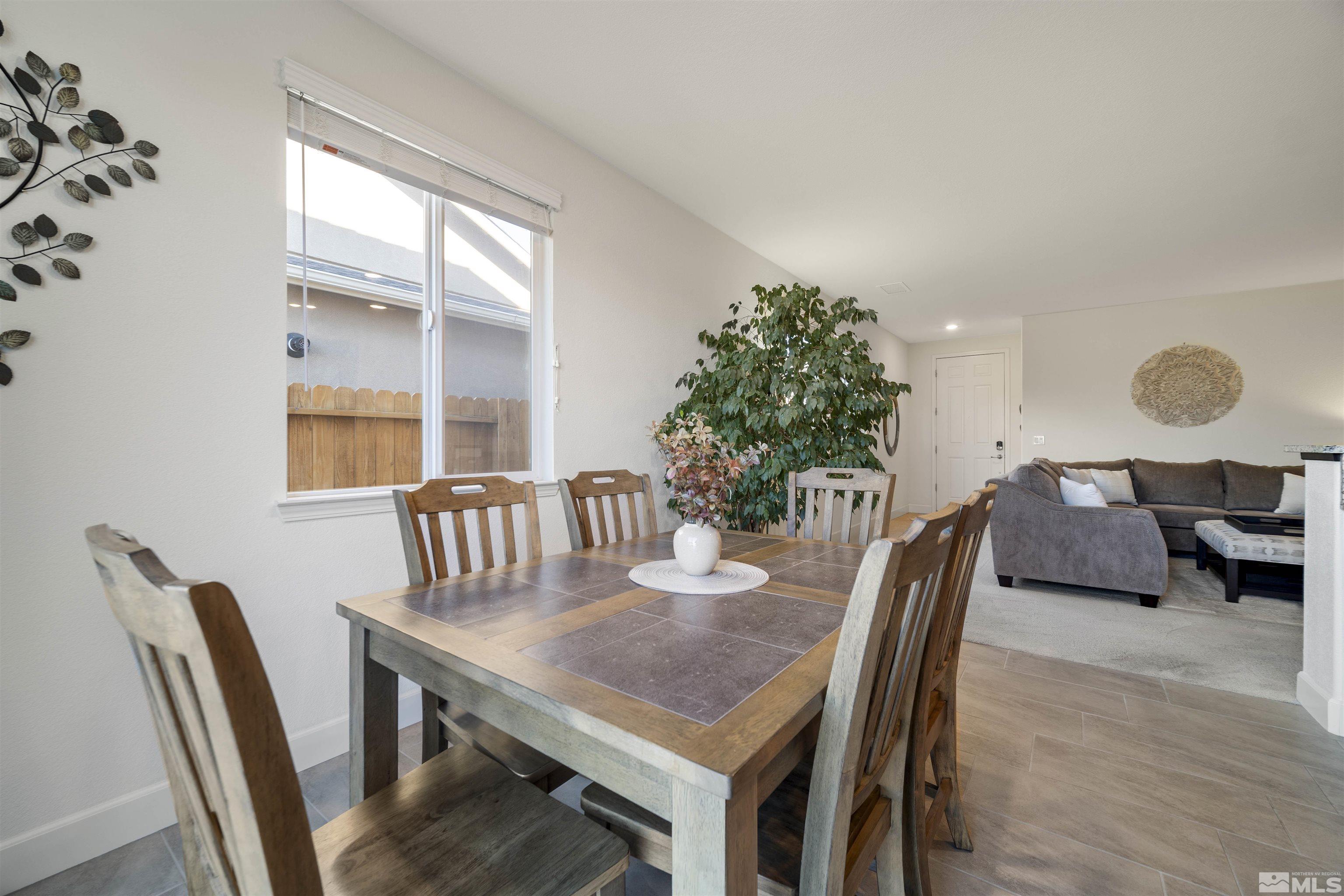 6713 Eagle Peak Drive Carson City, NV 89701 - Photo 16 of 40 a view of a dining room with furniture and wooden floor