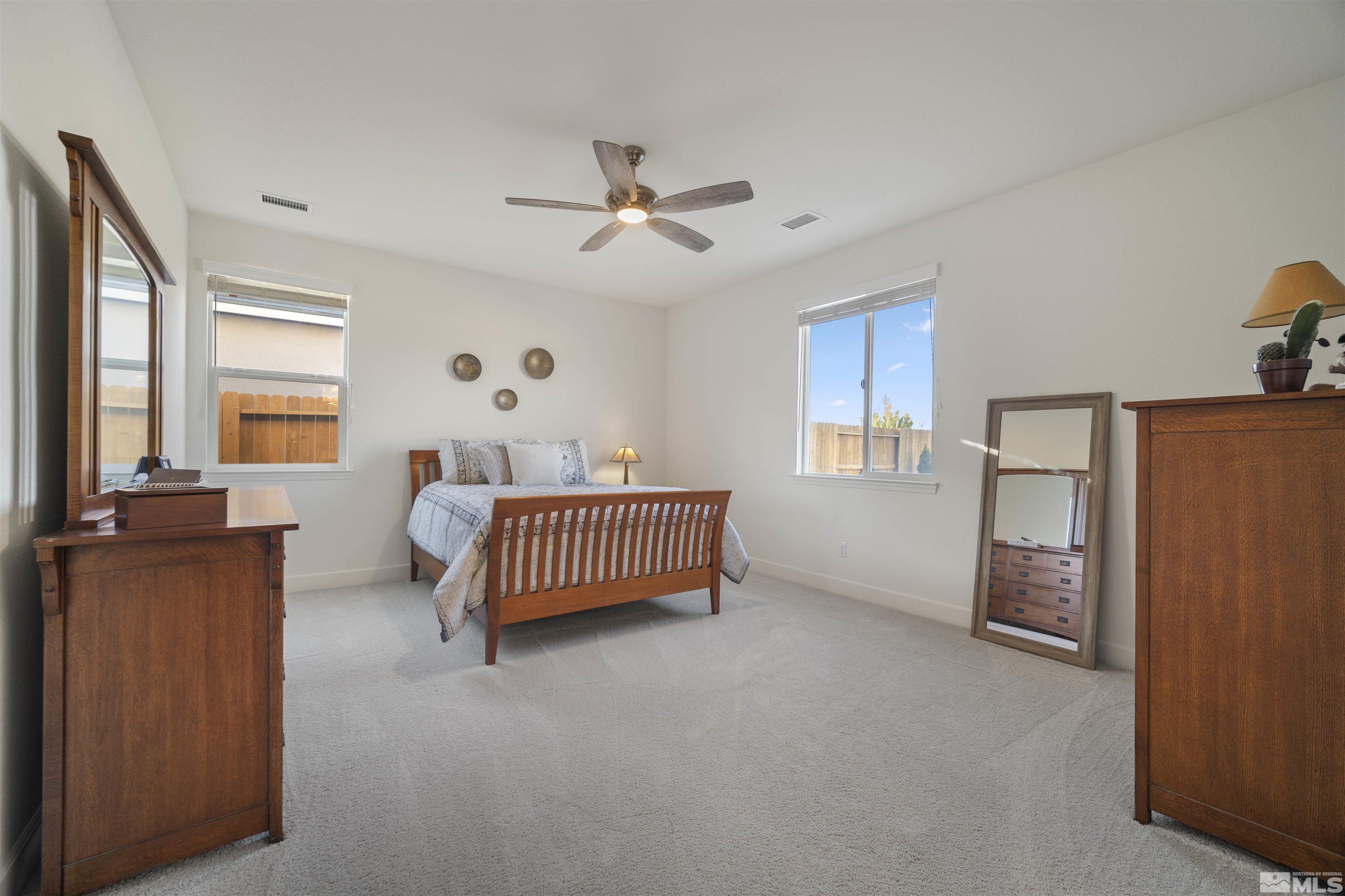 6713 Eagle Peak Drive Carson City, NV 89701 - Photo 17 of 40 a bedroom with a bed and window