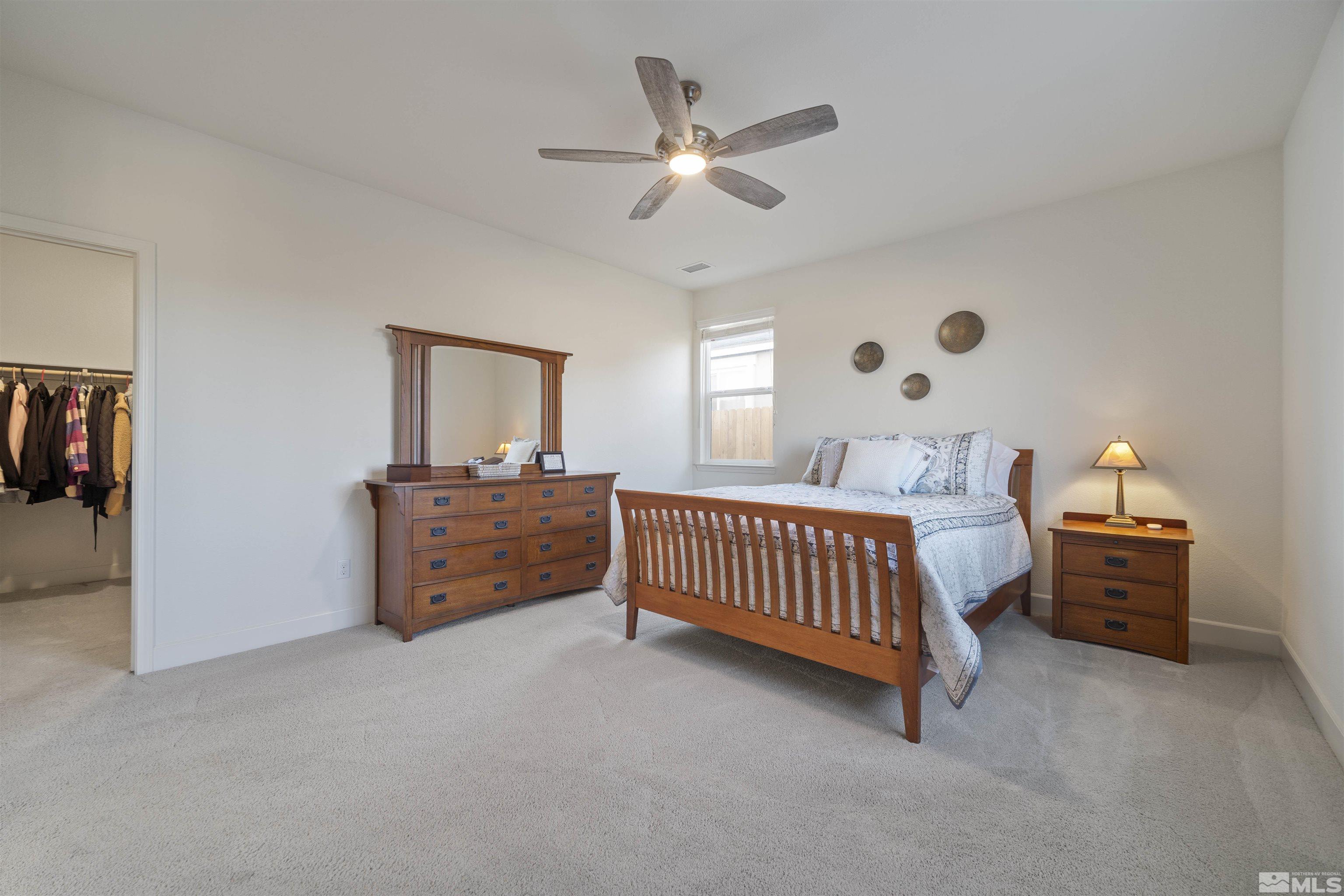 6713 Eagle Peak Drive Carson City, NV 89701 - Photo 18 of 40 a bed room with furniture and a window