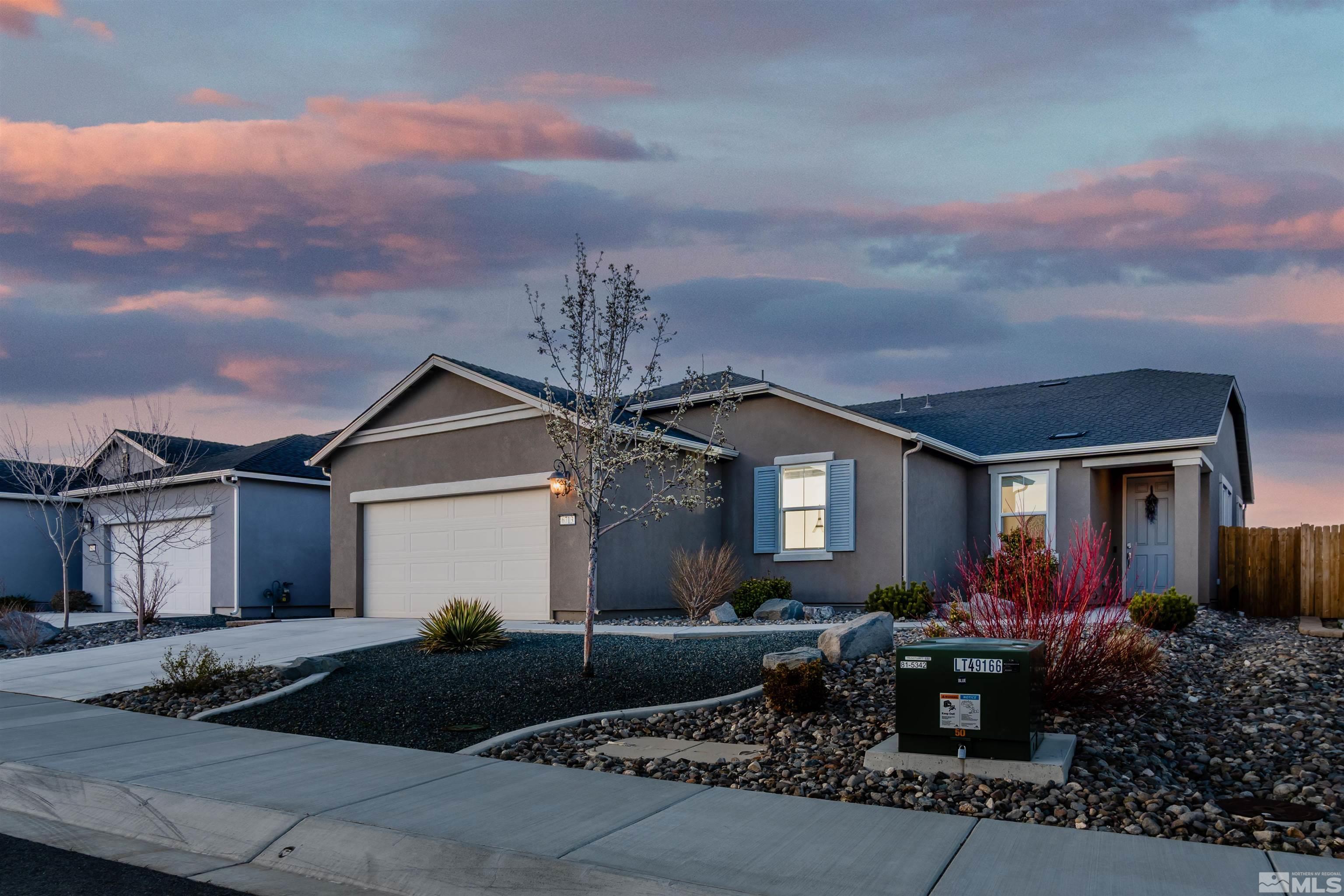6713 Eagle Peak Drive Carson City, NV 89701 - Photo 2 of 40 a front view of house with yard and trees around