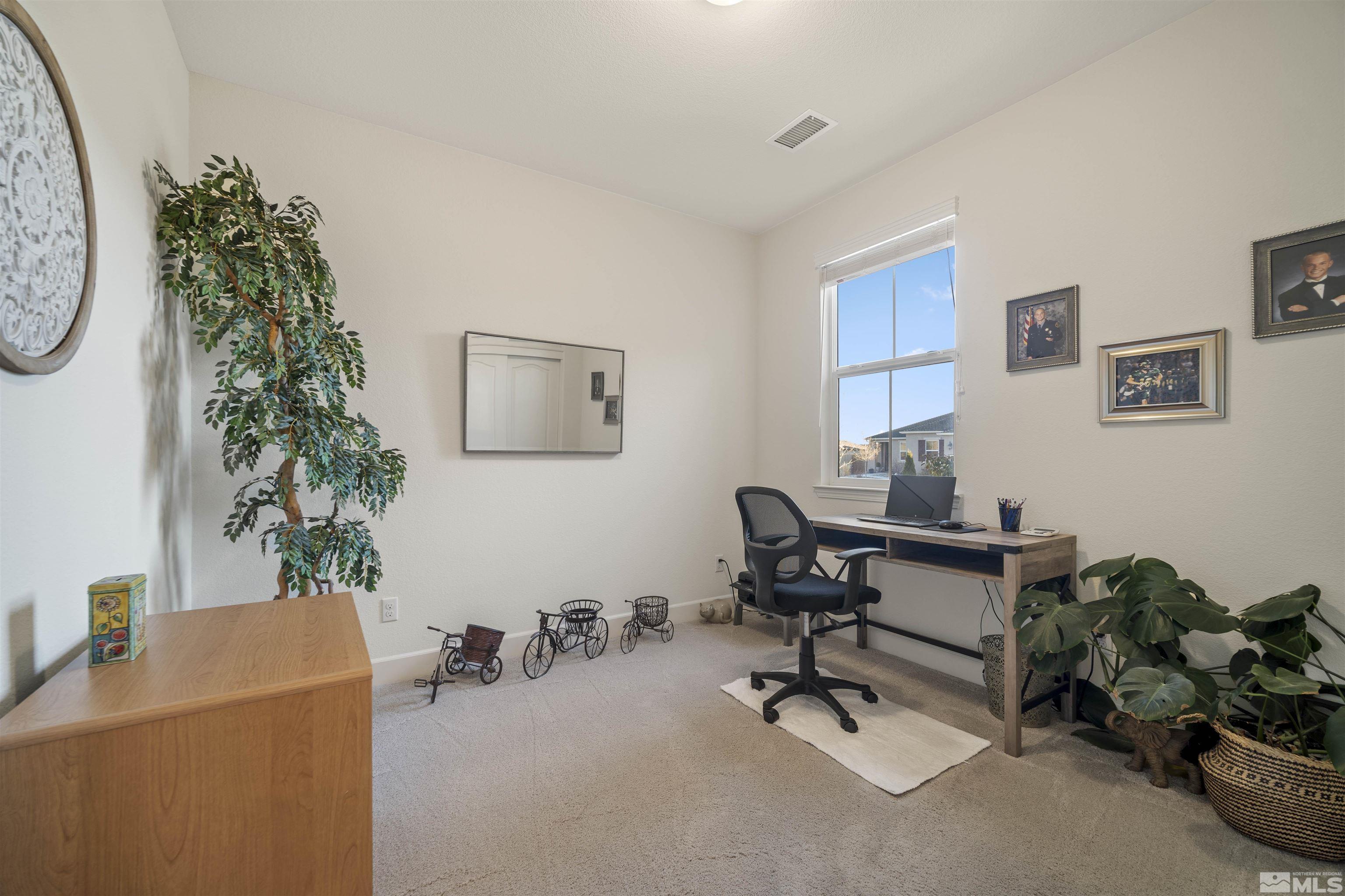 6713 Eagle Peak Drive Carson City, NV 89701 - Photo 25 of 40 a view of a workspace with furniture and a workspace