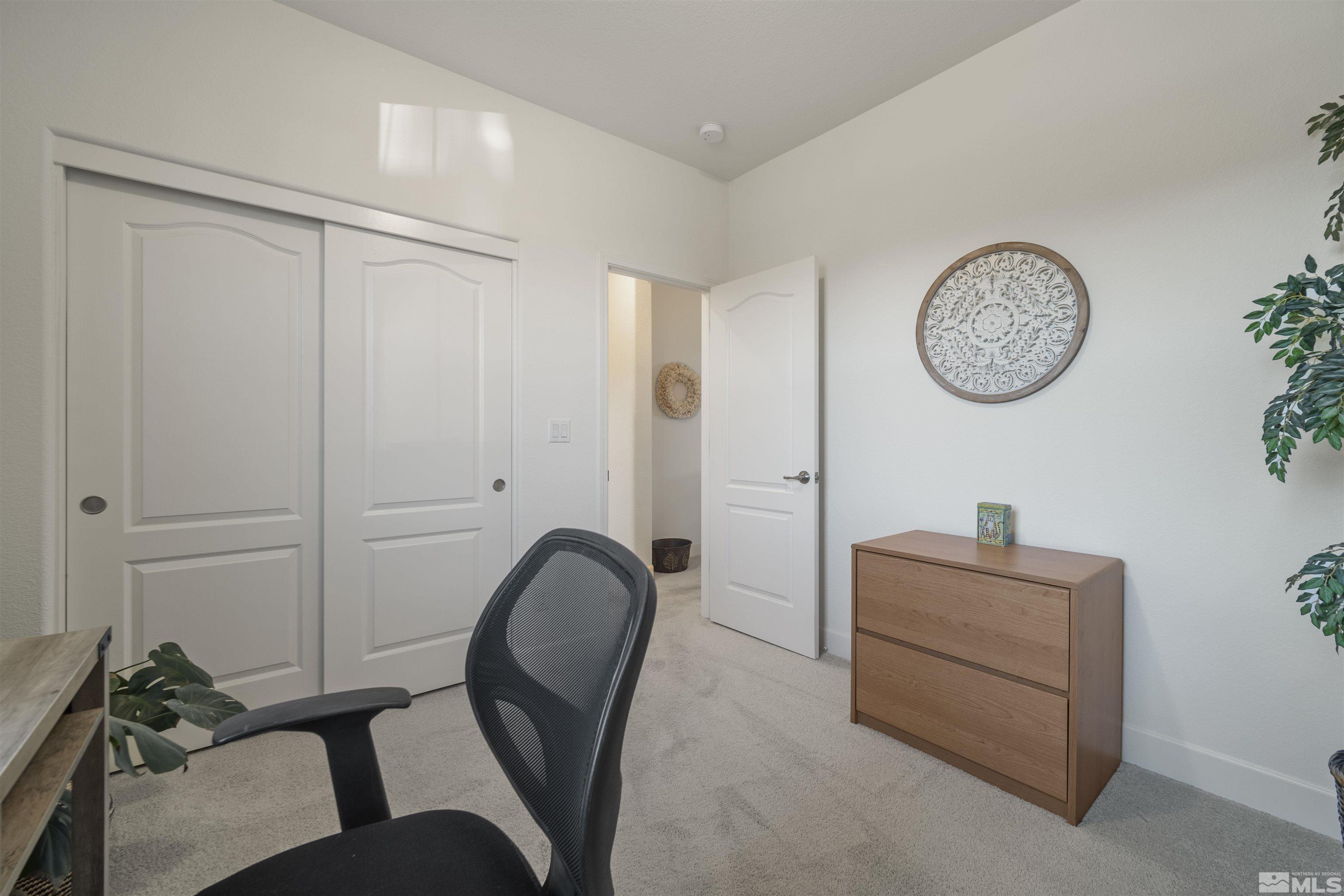 6713 Eagle Peak Drive Carson City, NV 89701 - Photo 26 of 40 a view of a room with a table and a chair