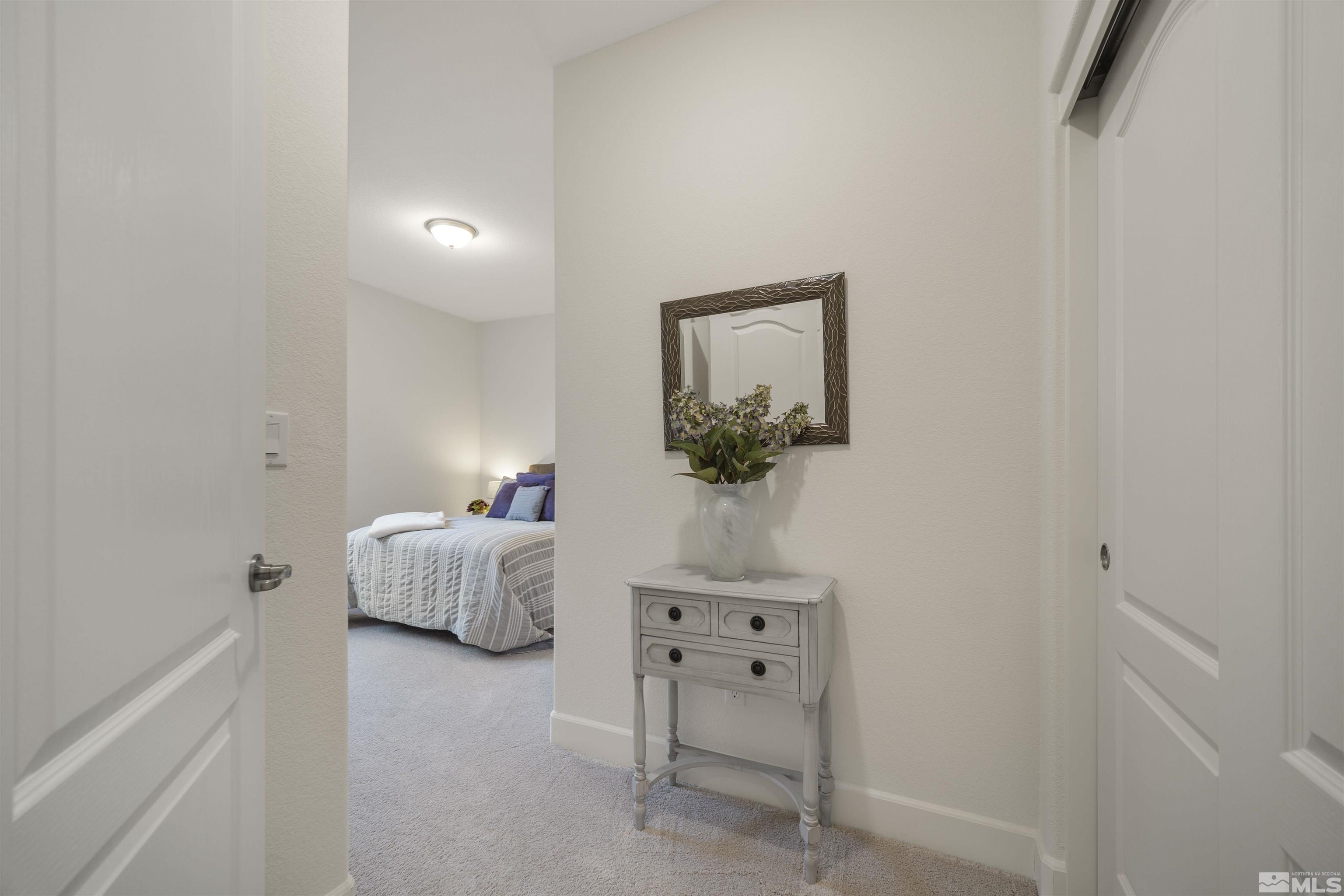 6713 Eagle Peak Drive Carson City, NV 89701 - Photo 29 of 40 a bedroom with a bed and a table