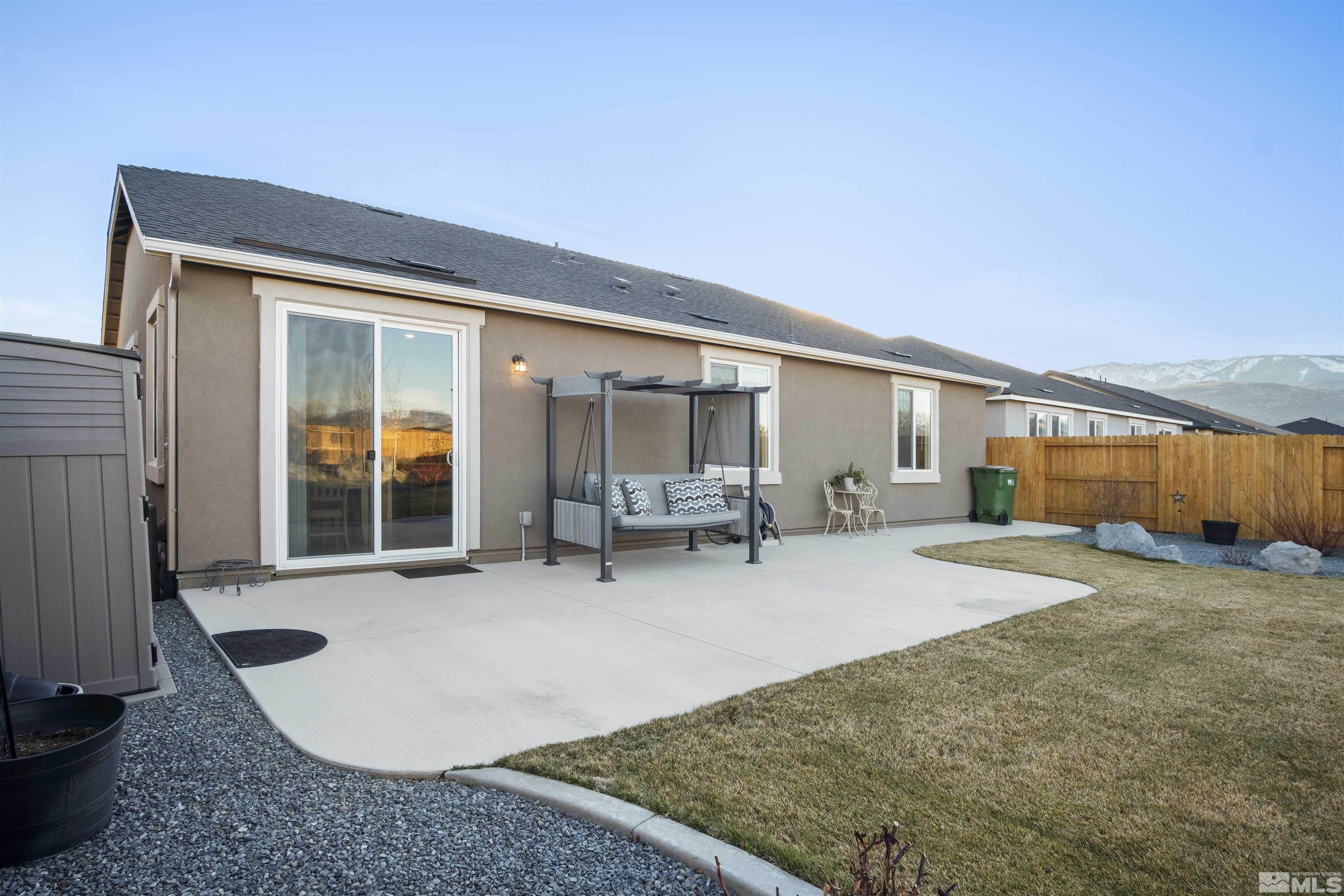 6713 Eagle Peak Drive Carson City, NV 89701 - Photo 38 of 40 a view of a house with backyard and sitting area