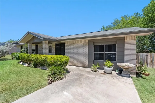 a view of a house with a street