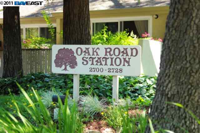 2700 Oak Road, Unit 28 Walnut Creek, CA 94597 - Photo 1 of 1 a sign broad in front of the tree