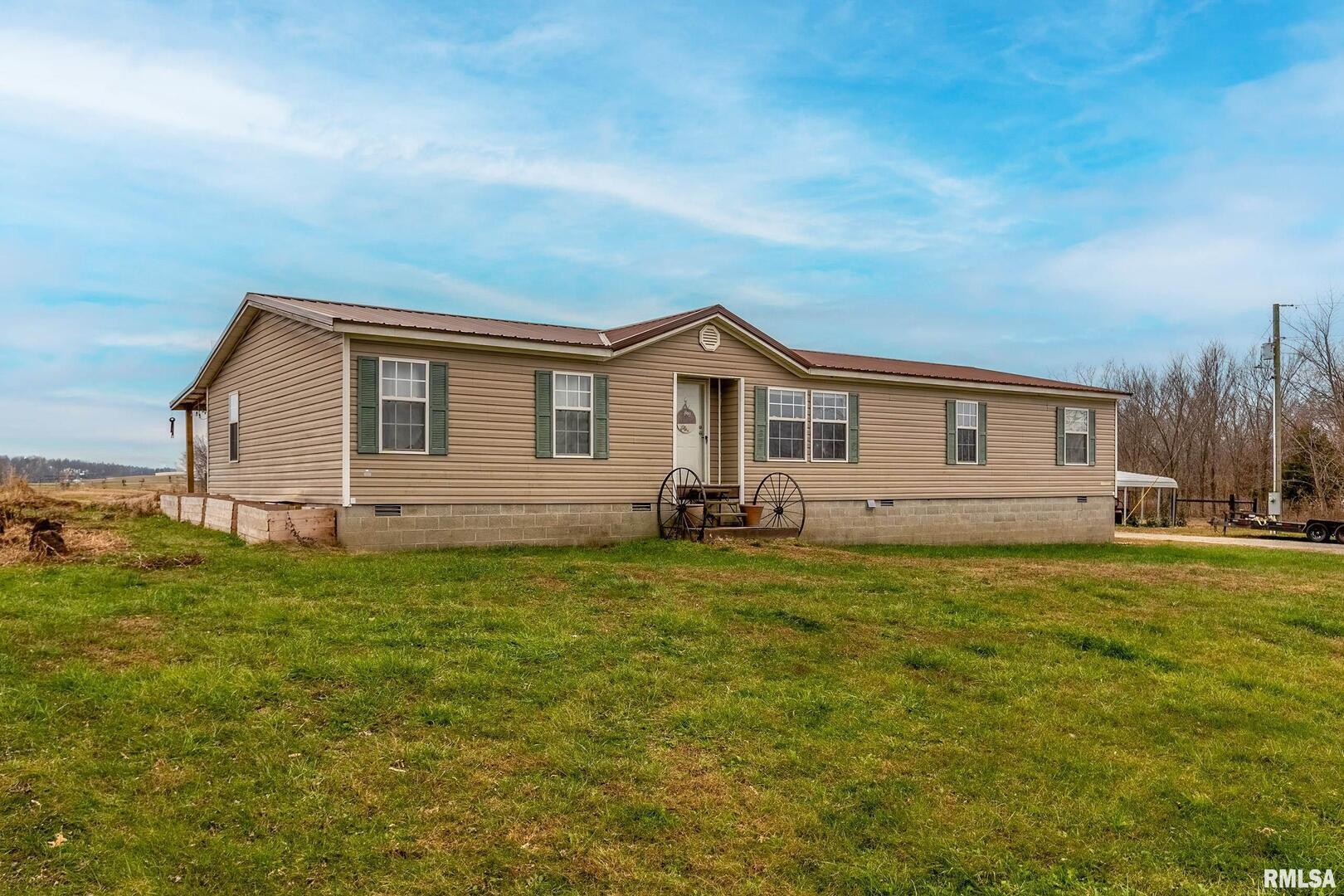 3996 Belgium Road Mulkeytown, IL 62865 - Photo 14 of 49 a front view of a house with a garden