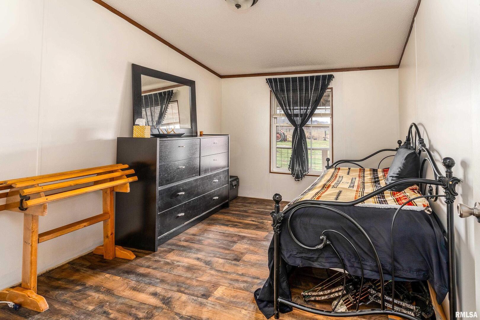 3996 Belgium Road Mulkeytown, IL 62865 - Photo 32 of 49 a bedroom with furniture and a window