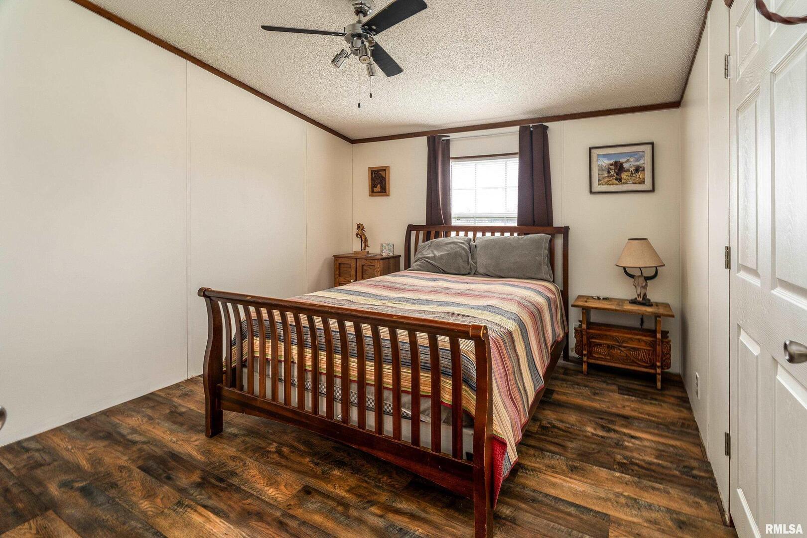 3996 Belgium Road Mulkeytown, IL 62865 - Photo 35 of 49 a bed sitting in a spacious bedroom next to a window