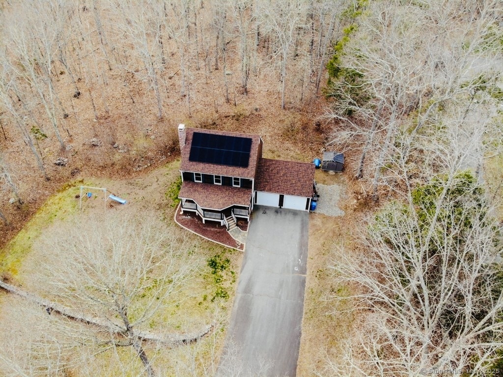 a building with a bench and trees