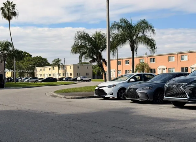 a view of street with parked cars