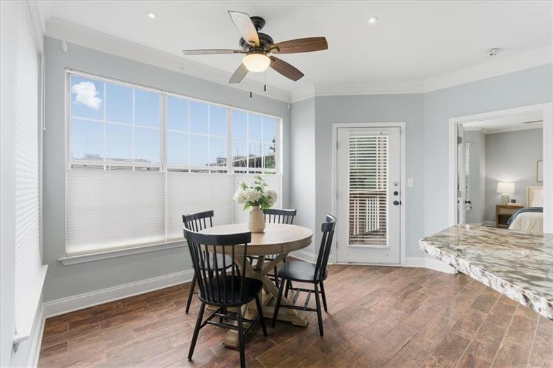 200 Renaissance Parkway Northeast, Unit 304 Atlanta, GA 30308 - Photo 14 of 40 a view of a dining room with furniture and a chandelier fan