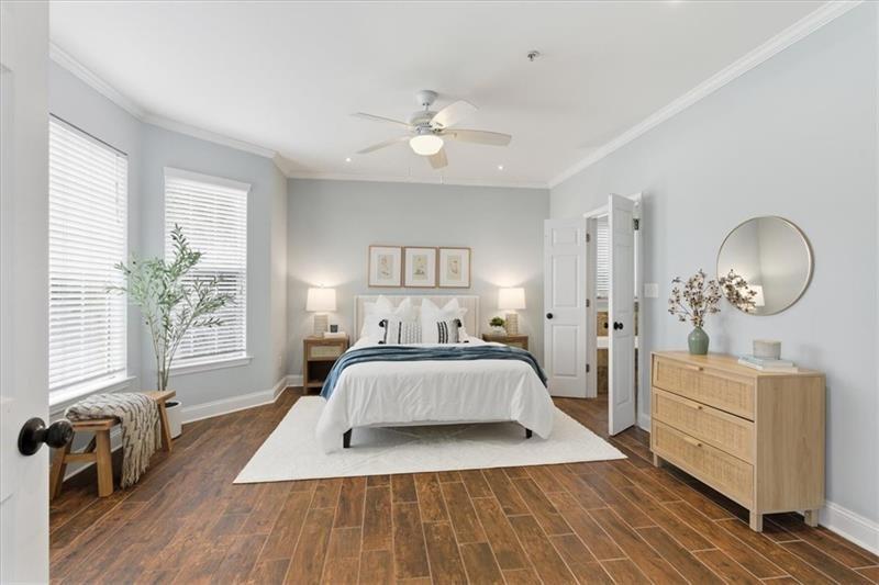 200 Renaissance Parkway Northeast, Unit 304 Atlanta, GA 30308 - Photo 16 of 40 a large bedroom with wooden floor and window