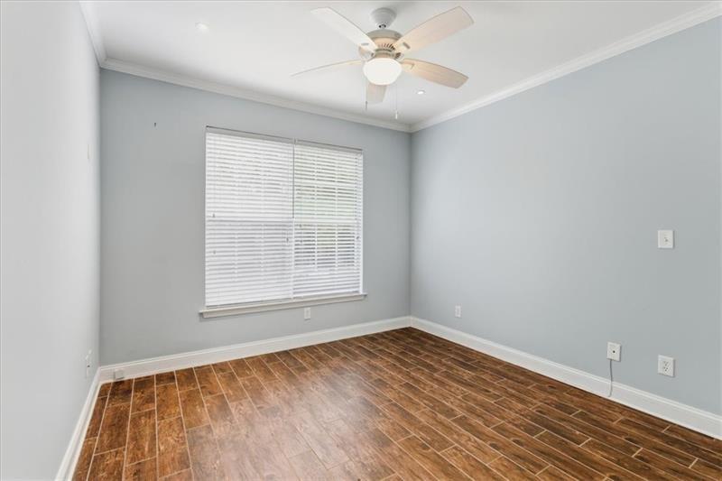 200 Renaissance Parkway Northeast, Unit 304 Atlanta, GA 30308 - Photo 21 of 40 wooden floor in an empty room with a window