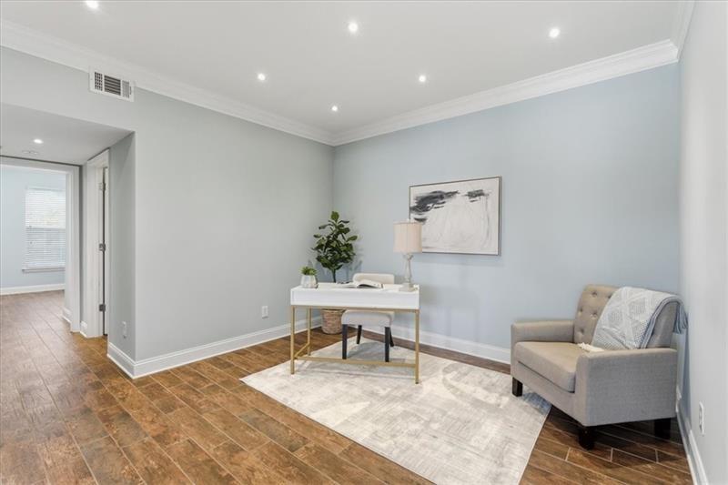 200 Renaissance Parkway Northeast, Unit 304 Atlanta, GA 30308 - Photo 4 of 40 a living room with furniture and a rug