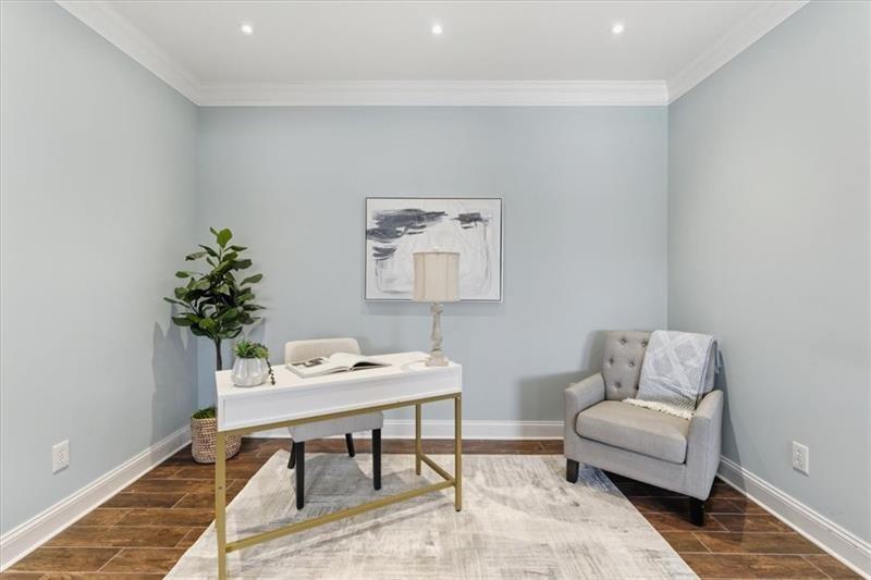 200 Renaissance Parkway Northeast, Unit 304 Atlanta, GA 30308 - Photo 5 of 40 a living room with furniture and a potted plant