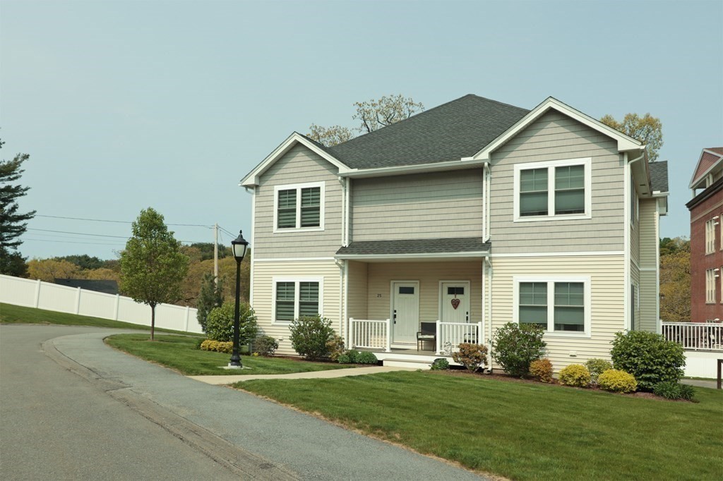 25 Eagle Nest Road, Unit 25 Clinton, MA 01510 - Photo 1 of 38 a front view of a house with a yard