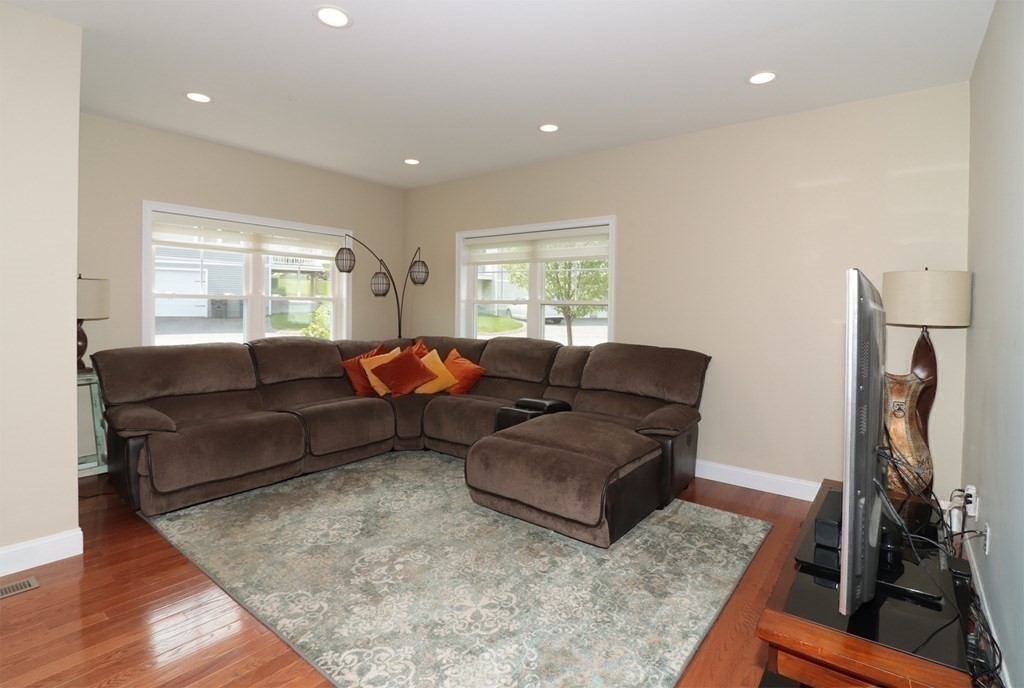 25 Eagle Nest Road, Unit 25 Clinton, MA 01510 - Photo 11 of 38 a living room with furniture and a flat screen tv