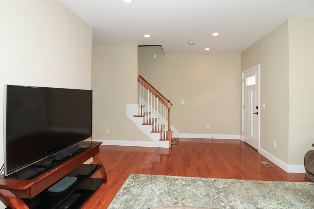 25 Eagle Nest Road, Unit 25 Clinton, MA 01510 - Photo 14 of 38 a living room with furniture and a flat screen tv
