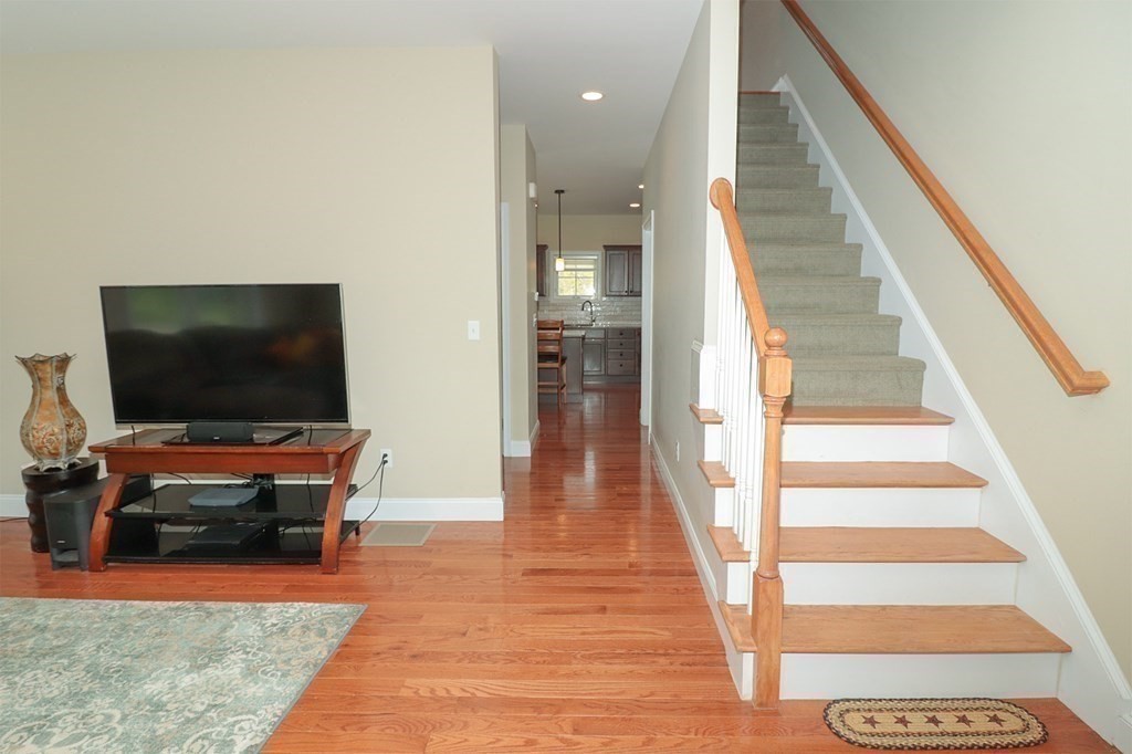25 Eagle Nest Road, Unit 25 Clinton, MA 01510 - Photo 17 of 38 a living room with furniture and a flat screen tv