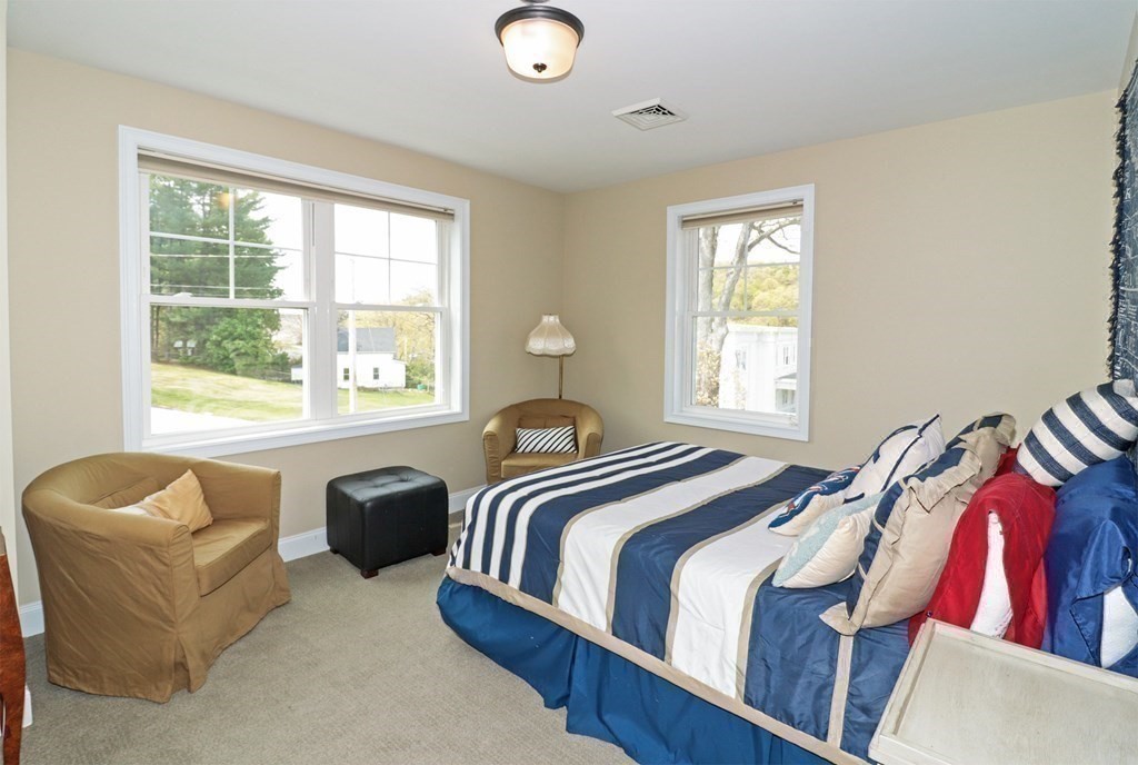 25 Eagle Nest Road, Unit 25 Clinton, MA 01510 - Photo 24 of 38 a bedroom with a bed and a couch
