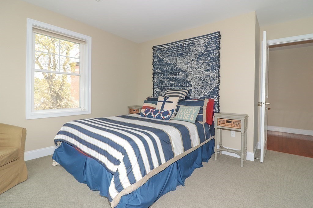 25 Eagle Nest Road, Unit 25 Clinton, MA 01510 - Photo 25 of 38 a bed sitting in a bedroom next to a window