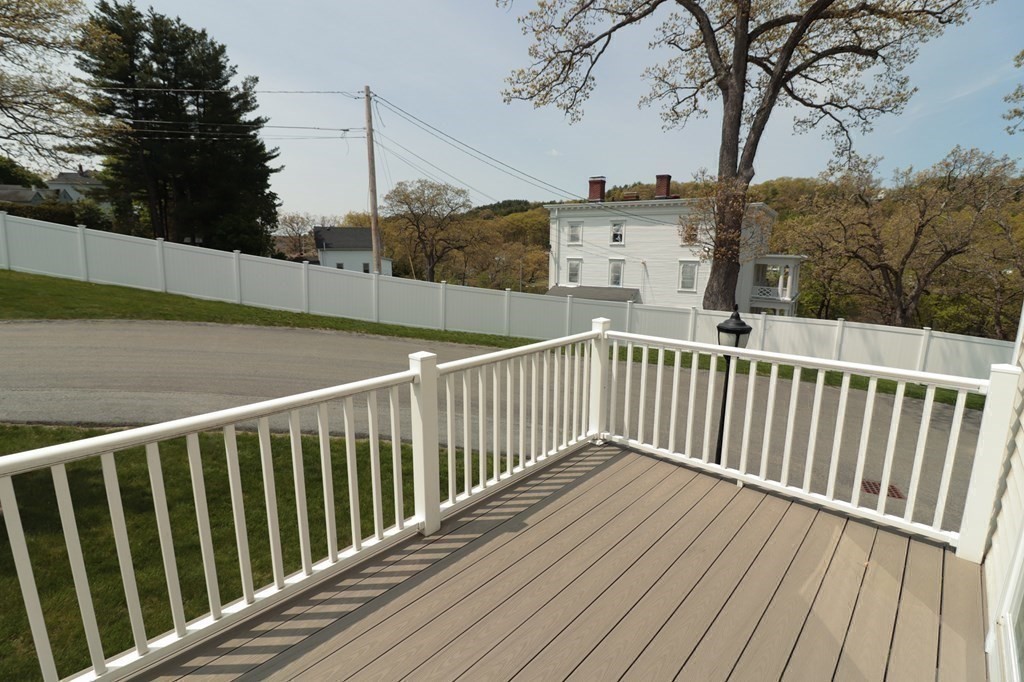 25 Eagle Nest Road, Unit 25 Clinton, MA 01510 - Photo 31 of 38 a view of balcony with wooden floor and fence
