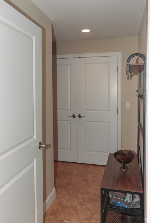 25 Eagle Nest Road, Unit 25 Clinton, MA 01510 - Photo 32 of 38 a room with a door and a rug