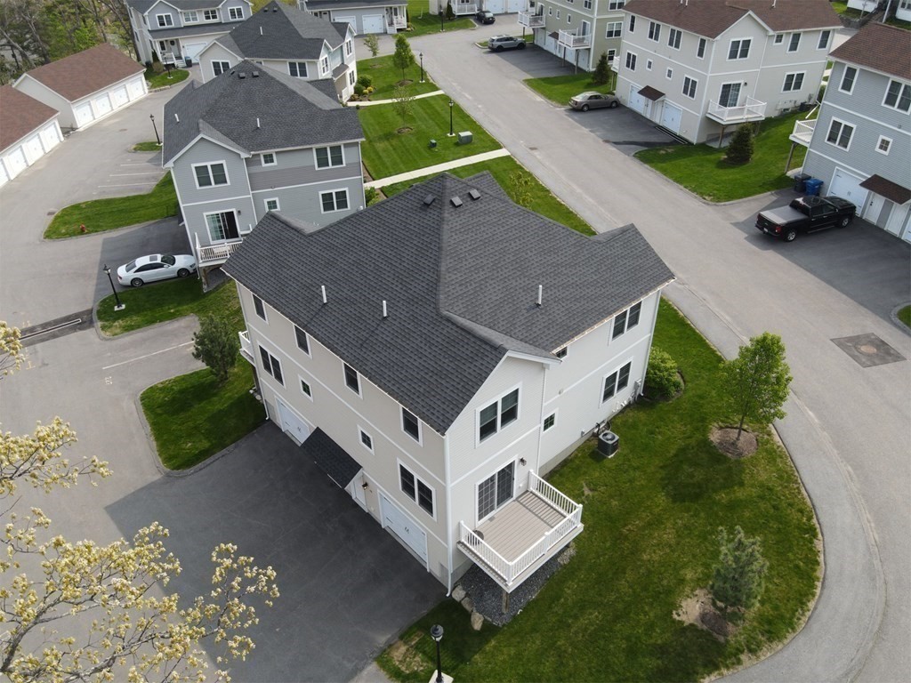 25 Eagle Nest Road, Unit 25 Clinton, MA 01510 - Photo 5 of 38 an aerial view of a house with a garden