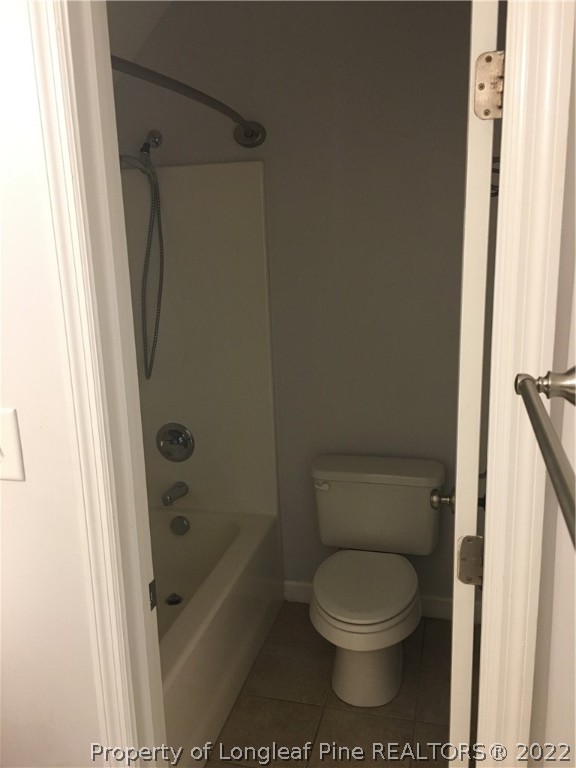 1409 Blue Ribbon Lane Hope Mills, NC 28348 - Photo 17 of 19 a bathroom with a toilet and a shower