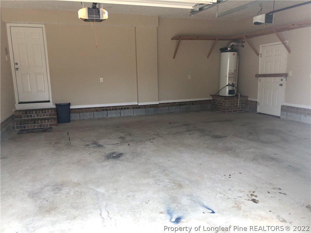 1409 Blue Ribbon Lane Hope Mills, NC 28348 - Photo 18 of 19 an empty room with a fireplace