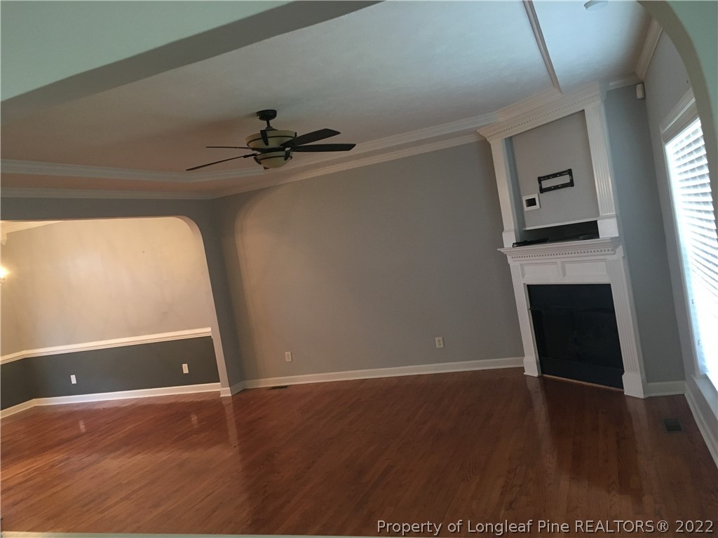 1409 Blue Ribbon Lane Hope Mills, NC 28348 - Photo 4 of 19 wooden floor in an empty room with a window