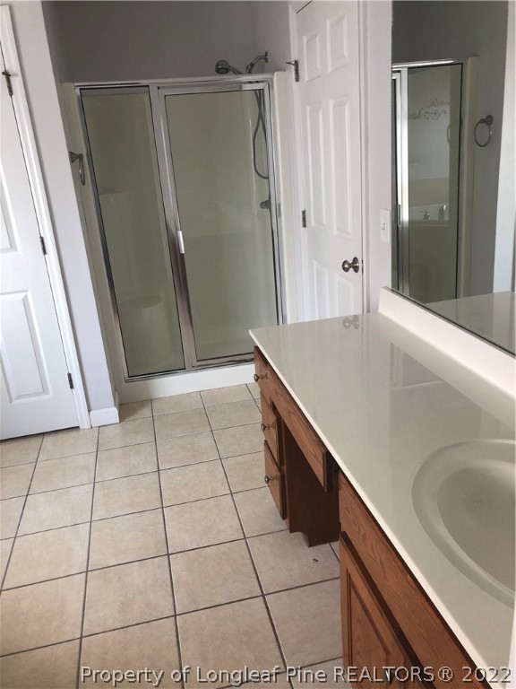 1409 Blue Ribbon Lane Hope Mills, NC 28348 - Photo 10 of 19 a view of bathroom with bathtub and shower