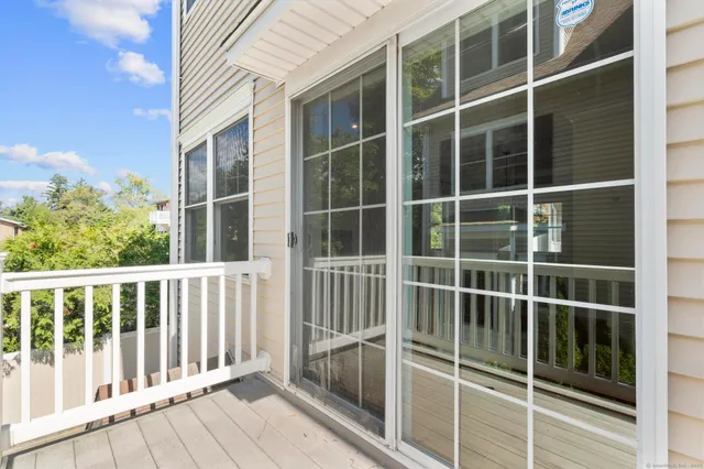 a view of a balcony with a floor to ceiling window
