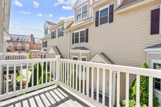 a view of a brick building from a balcony