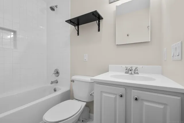 a bathroom with a sink a toilet and a bathtub