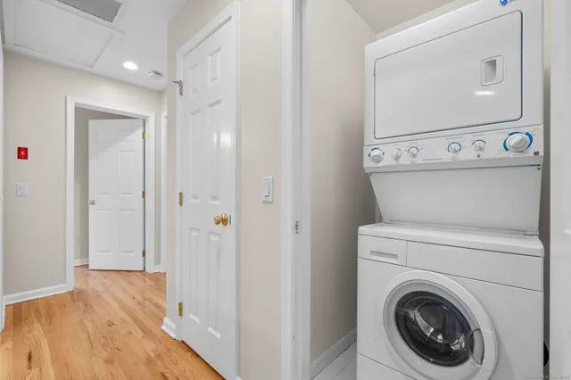 a view of a hallway with washer and dryer