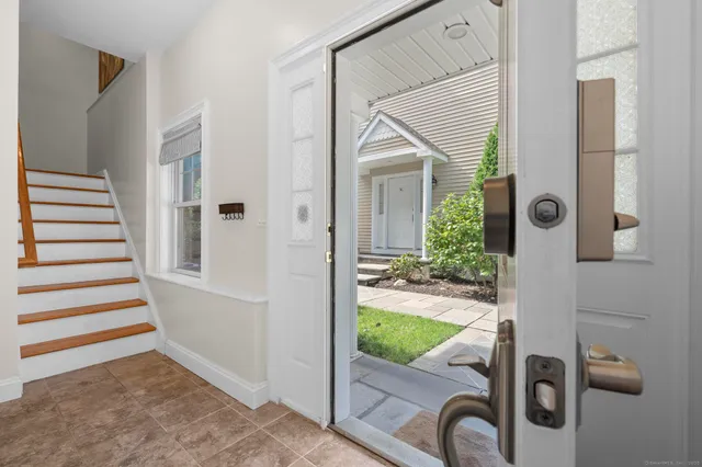 an entryway with a livingroom view and a living room
