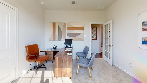 a living room with furniture and a window