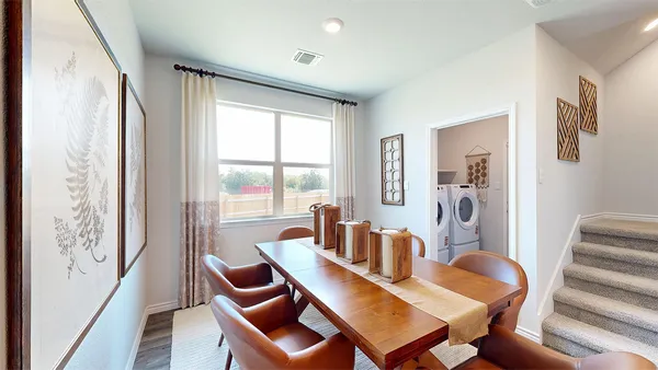 a view of a dining room with furniture window and outside view