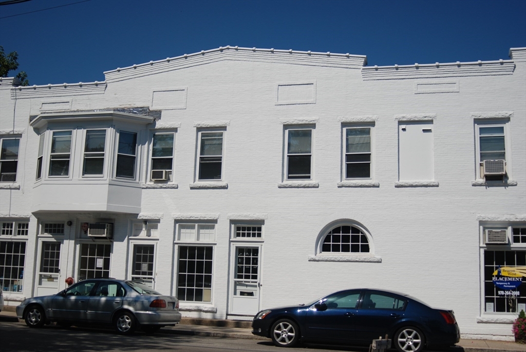 1 Windsor Avenue, Unit 1 Acton, MA 01720 - Photo 1 of 14 a couple of cars parked in front of a building