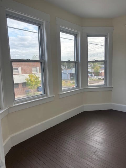 1 Windsor Avenue, Unit 1 Acton, MA 01720 - Photo 11 of 14 a view of an empty room with wooden floor and a window